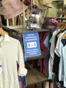 A social distancing notice in a Princess Alice Hospice shop
