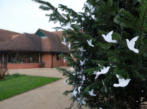 side view of Christmas tree with doves