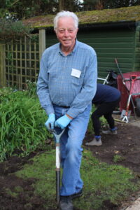 Smiling man with a shovel