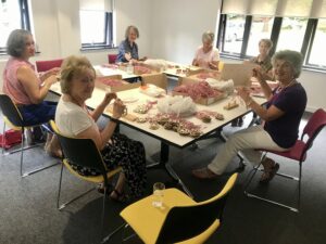 Ladies cording decorations around a table