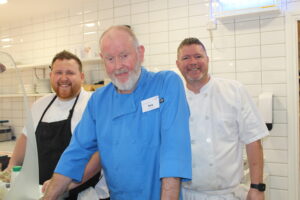 Chirs, Tony and David smiling at the camera