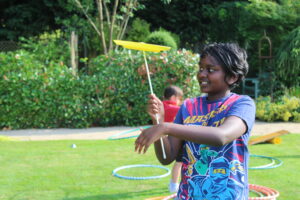 child in the hospice gardens playing