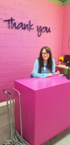 Fiona behind the shop counter