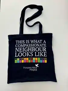 Tote bag with Compassionate Neighbour logo on
