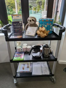 Carers coffee morning trolley with cups and coffee