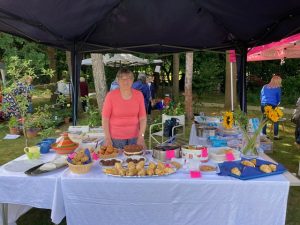 Jean Deane at a cake stand
