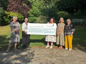 Choir accepting big cheque