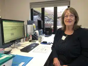 Gill Holland at her desk