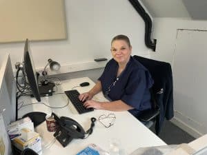 Teresa at her desk