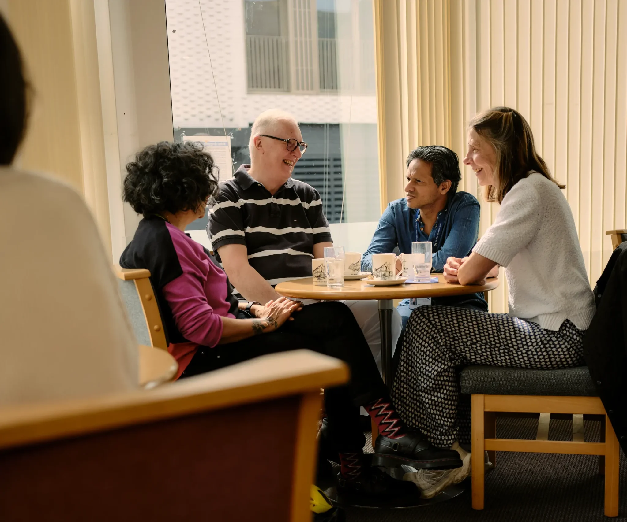 People having a chat over coffee