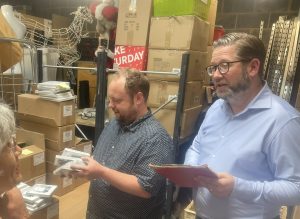 Chris Jones and Jake Cressell sorting Christmas cards at the retail hub